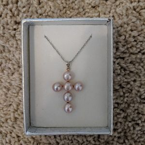 Cute pink cross necklace.